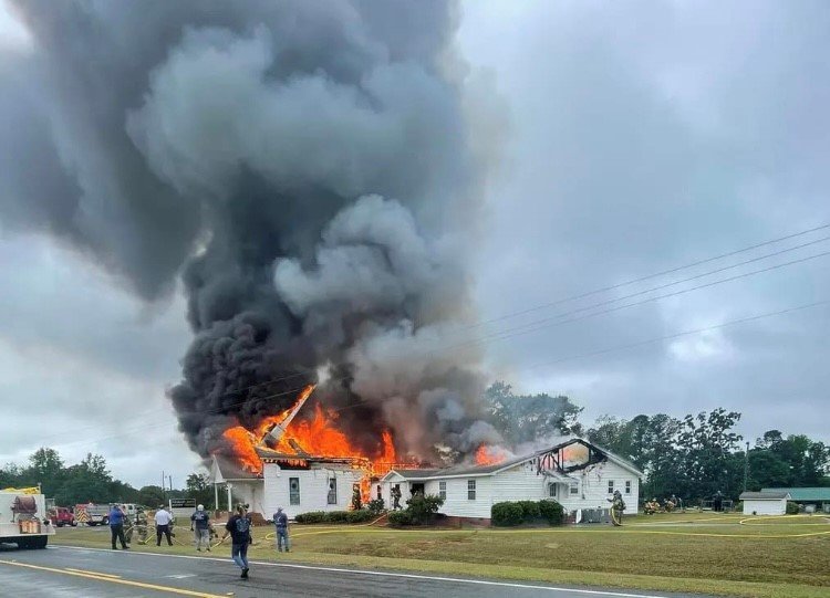 Firefighters battle a blaze at Pleasant Grove Baptist Church in Wrightsville. The church caught fire Friday morning. Photo/Pleasant Grove Baptist Church)